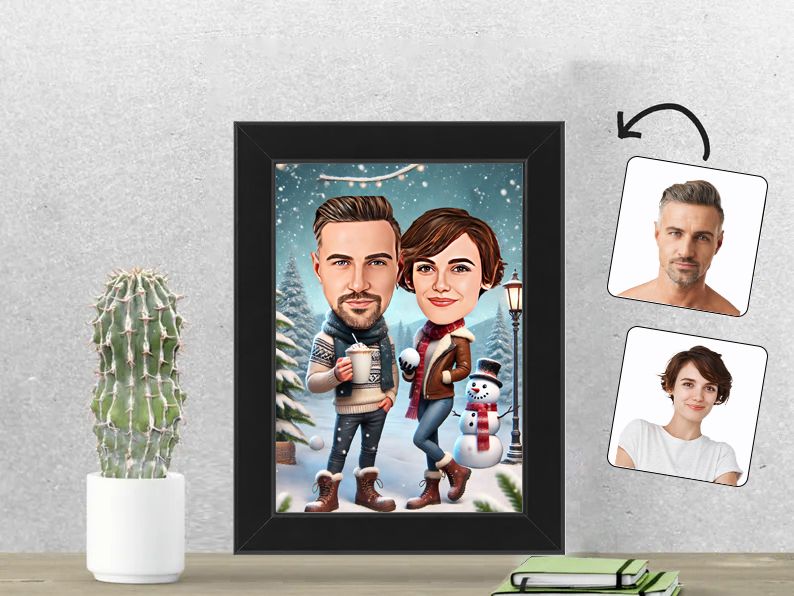 Gepersonaliseerde karikatuur van een stel genietend van sneeuwpret en winterse gezelligheid, afgedrukt in een 13x18 cm fotolijst. Perfect wintercadeau. gepersonaliseerd origineel cadeau