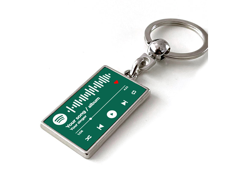 Gepersonaliseerde Spotify sleutelhanger met muziekspeler en groene achtergrond. Perfect cadeau voor muziekliefhebbers.