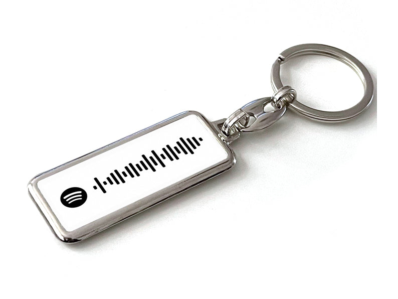 Gepersonaliseerde Spotify sleutelhanger in het wit met jouw favoriete songcode. Perfect cadeau voor muziekliefhebbers of als stijlvol accessoire.